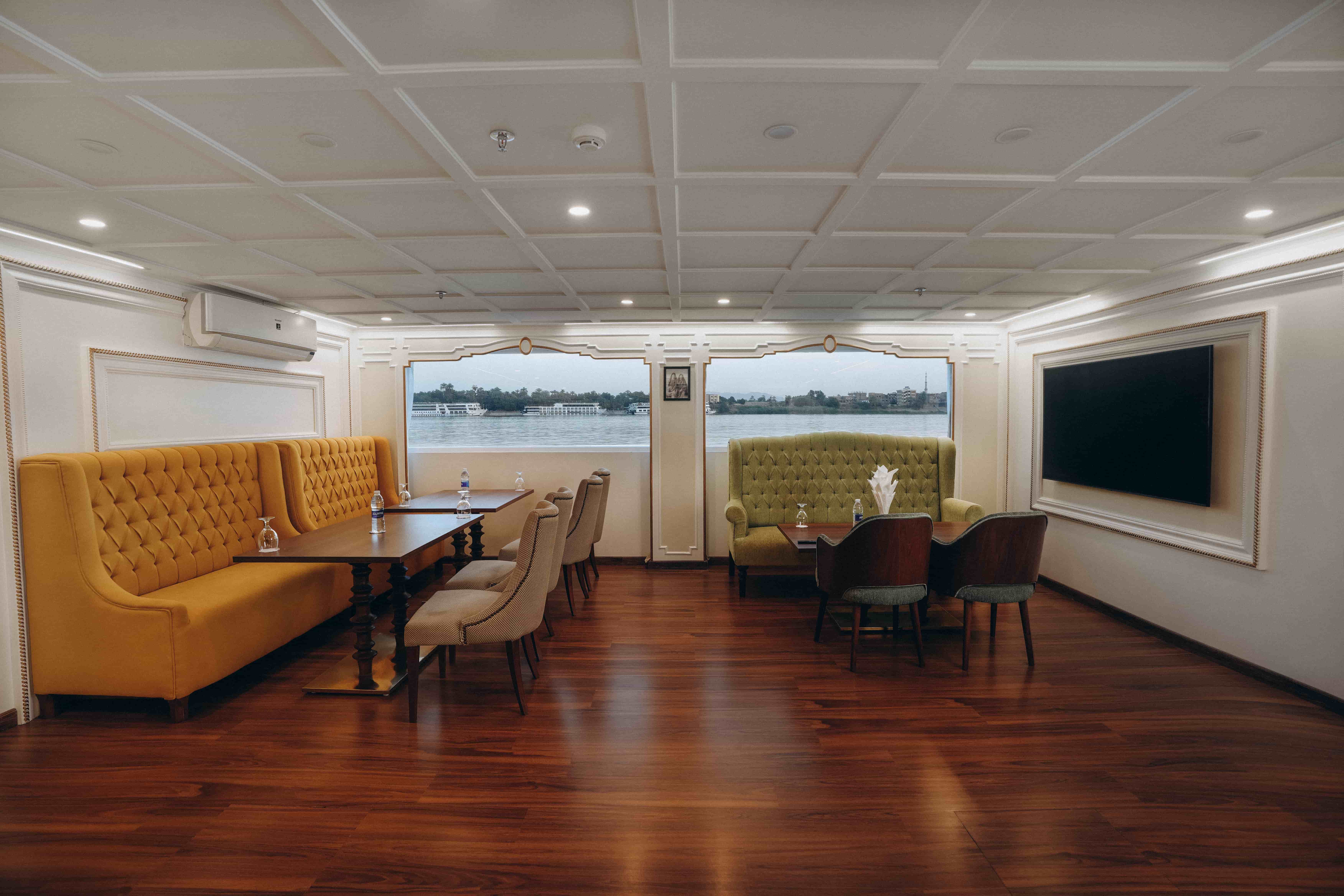 Indoor restaurant aboard La Rose Dahabiya